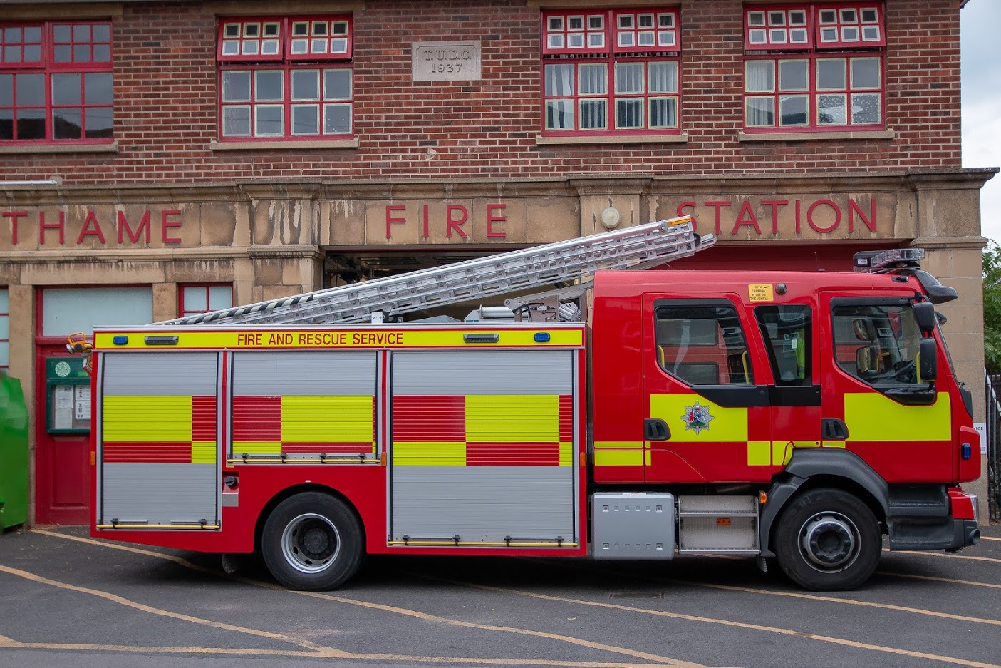 Thame Fire Station, a red-brick station building with a fire engine parked outside